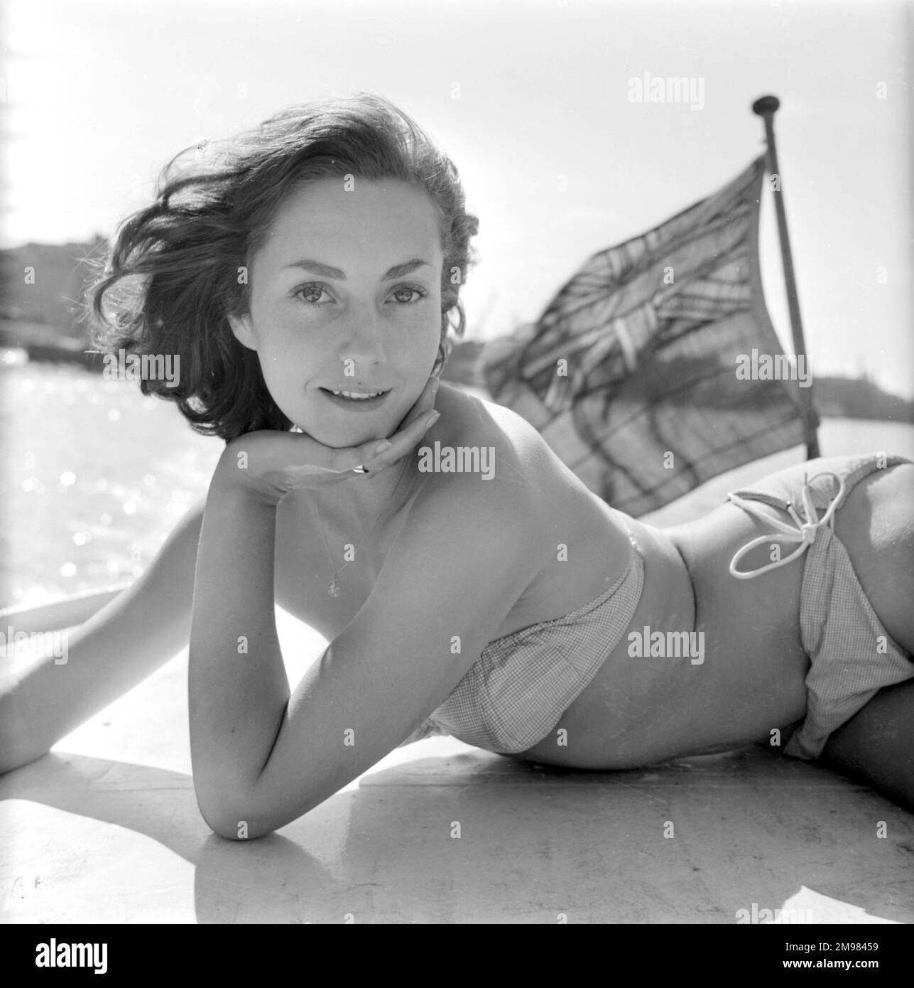 Young woman (Model - Geraldine Hill) modelling on a boat on the River Thames. Stock Photo