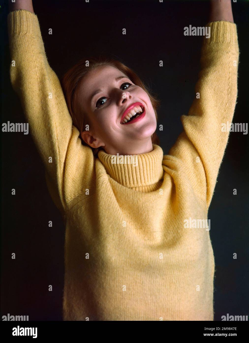 Advertisement for Pepsodent toothpaste female model wearing a yellow