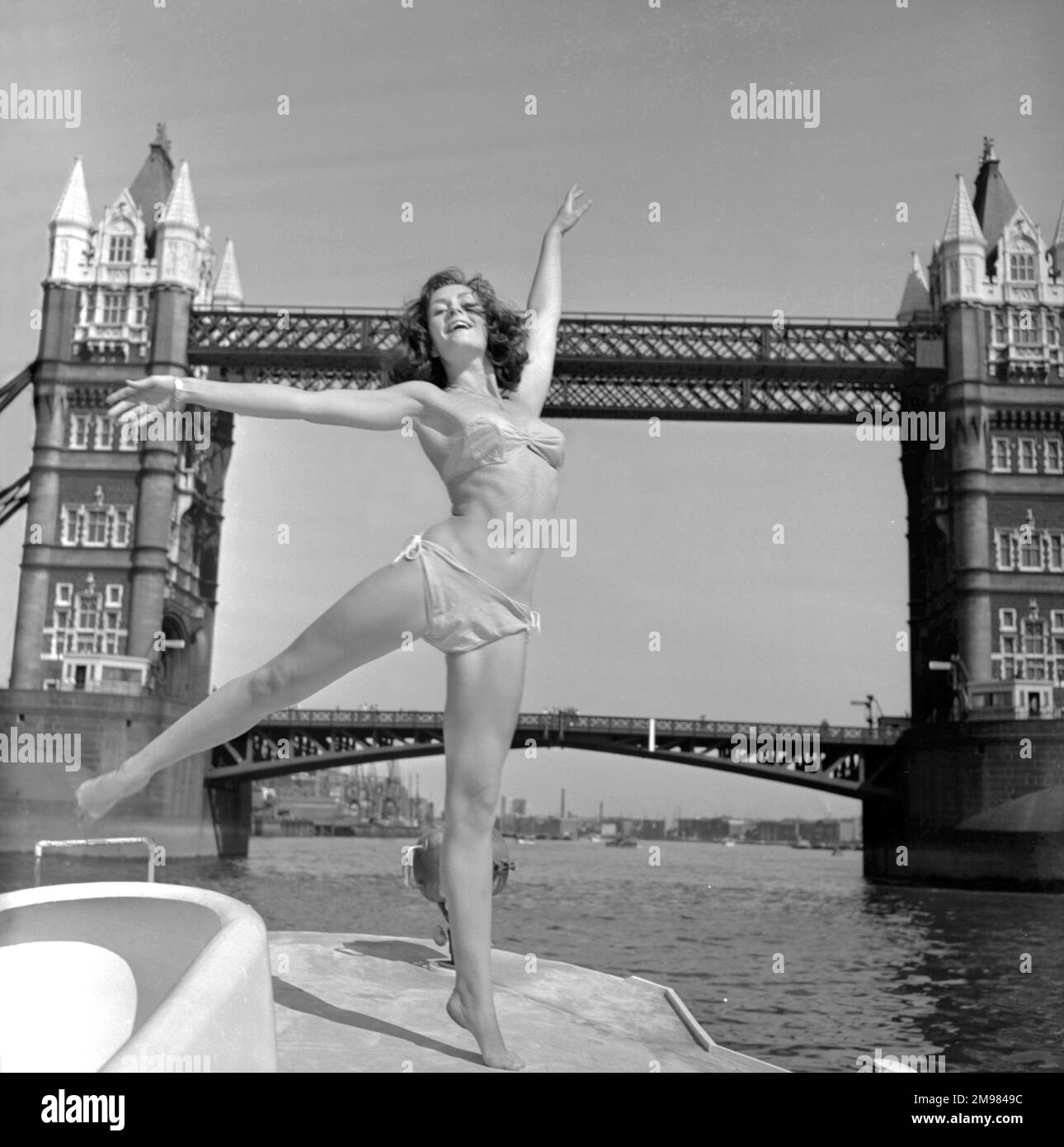 Young woman (Model - Geraldine Hill) modelling on a boat on the River Thames. Stock Photo