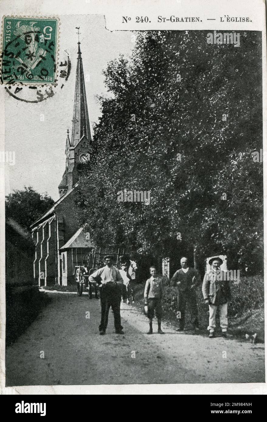 St Gratien Church, France. A rural scene, showing working French countrymen standing in the lane. Stock Photo