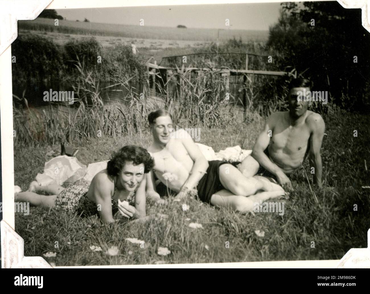 Three people relaxing at Lessingen, Germany, July 1945. Stock Photo
