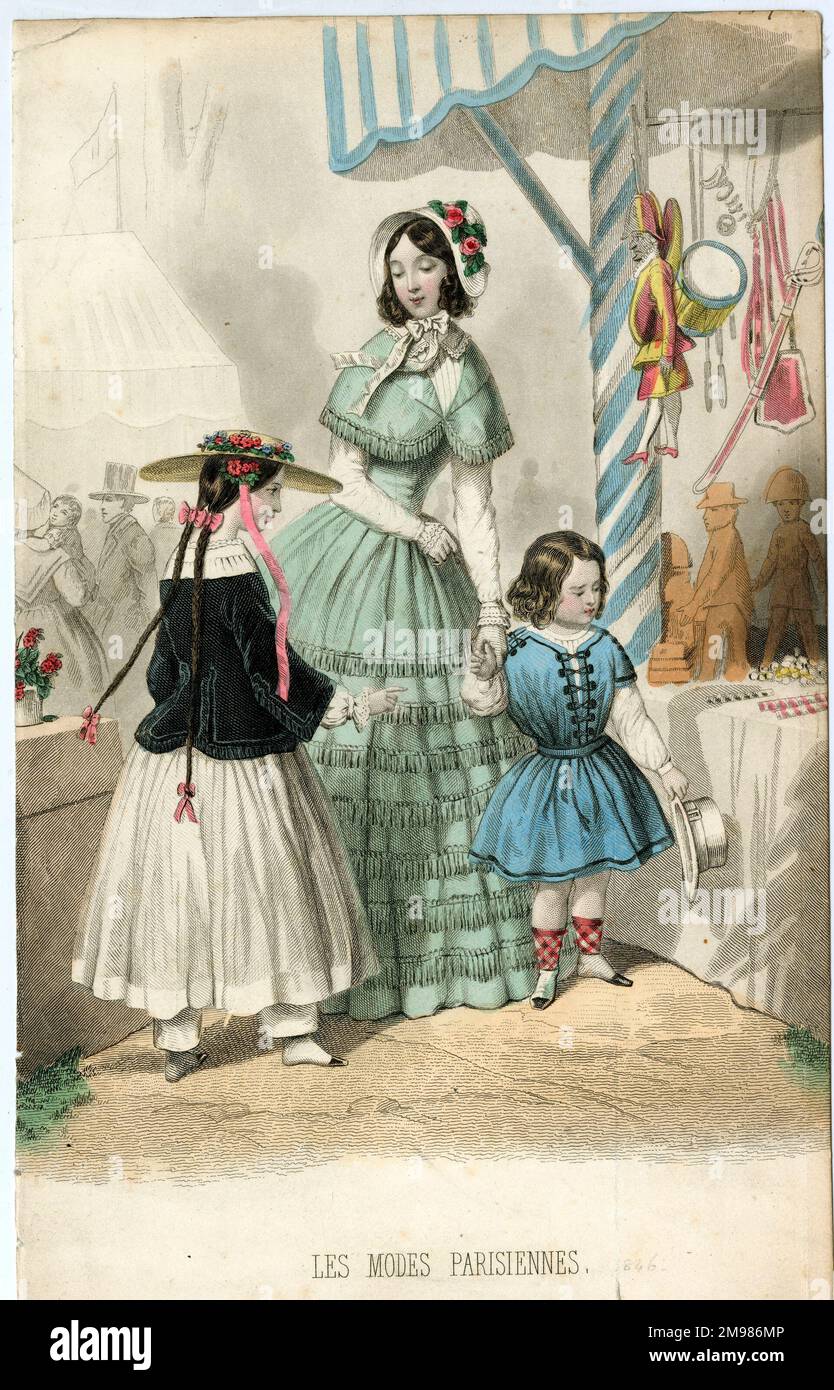 Parisian costume styles, woman with two children at a toy stall. Stock Photo