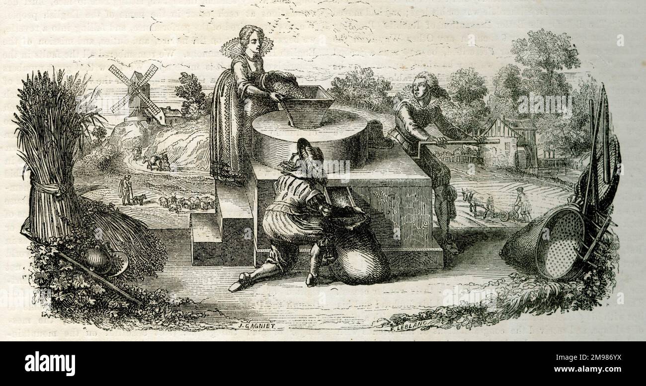 People operating a hand mill Stock Photo Alamy