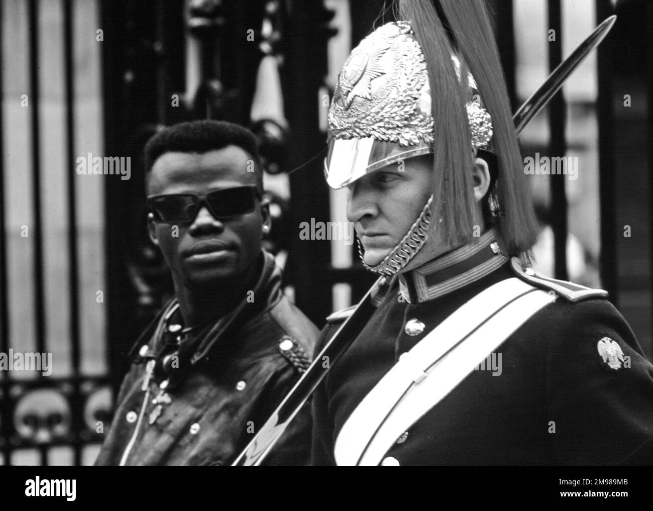 Guardsman with tourist spectator, Whitehall, London, England. Stock Photo