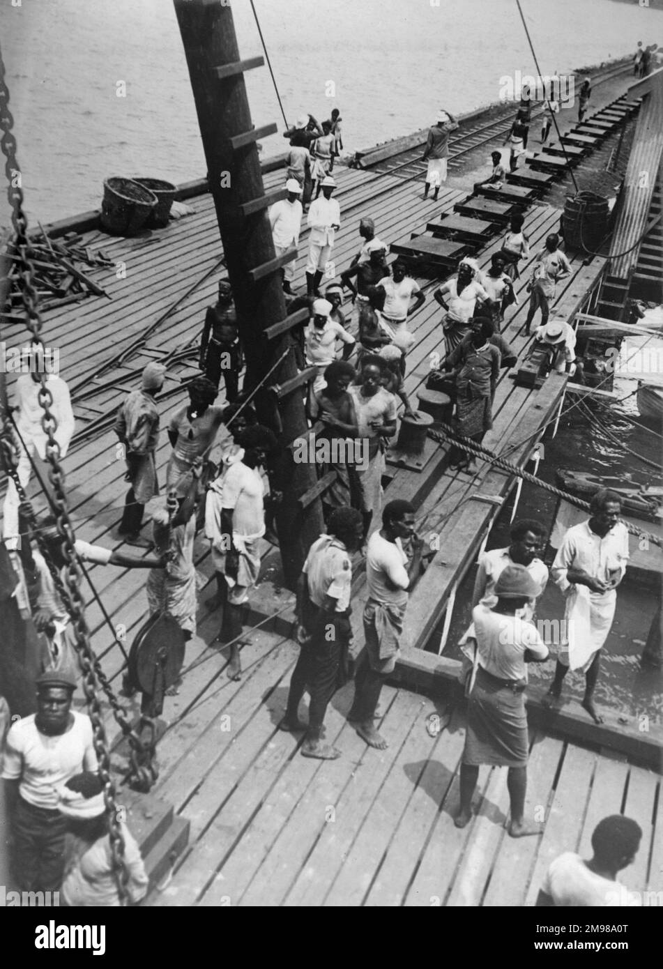 Labourers on the deck of a ship at the wharf, Lautoka, Fiji, South Pacific. Stock Photo
