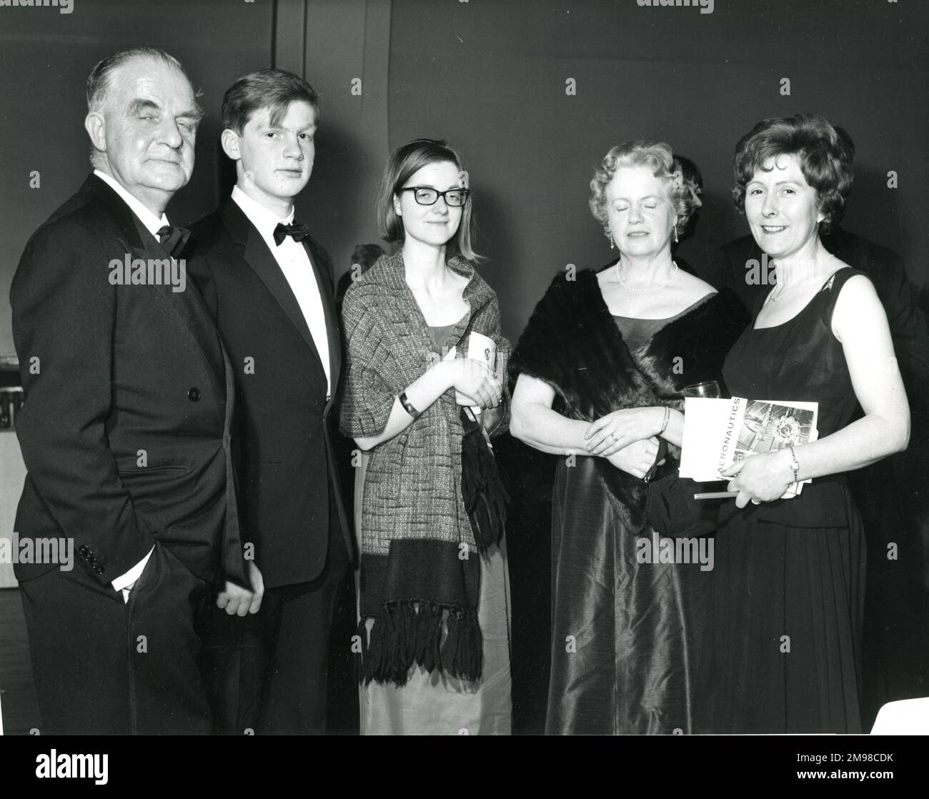 Among the guests at the Centenary Conversazione held at the Science Museum on 12 January 1966 were Dr Archie Ballantyne, RAeS Secretary, left, and members of his family(?). Stock Photo