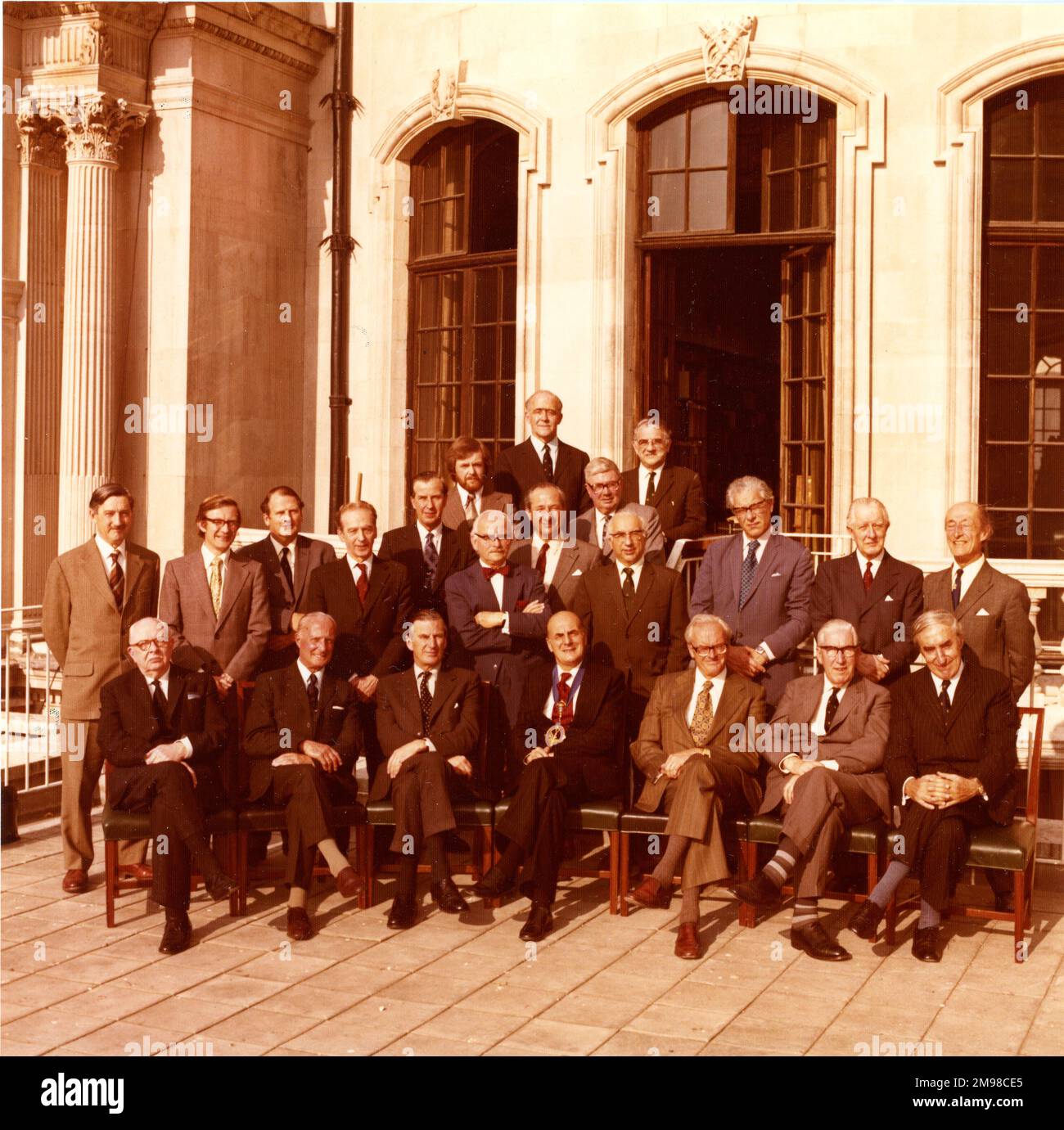 The 1974-1975 Royal Aeronautical Society Council on the terrace at No.4 Hamilton Place, 24 April 1975. Front row from left: Air Cdre Rod Banks, Air Cdre J.R. Morgan, AM Sir Charles Pringle, B.P. Laight, RAeS President; K.G. Wilkinson, S.D. Davies and W. Isbister, President, Australia Division. Second row from left: R.P. Probert, G.M. Moss, D.G. Brown, Capt E.M. Brown, Air Cdr F.C. Padfield, M.J. Brennan, Prof M.G. Farley, H. Zeffert, G. Wansbrough-White, Dr E.S. Moult and L.A. Wingfield, Honorary Solicitor. Rear from left: G. Weller, E.M.J. Schaffter, RAeS Secretary; Dr W.F. Hilton and Capt Stock Photo