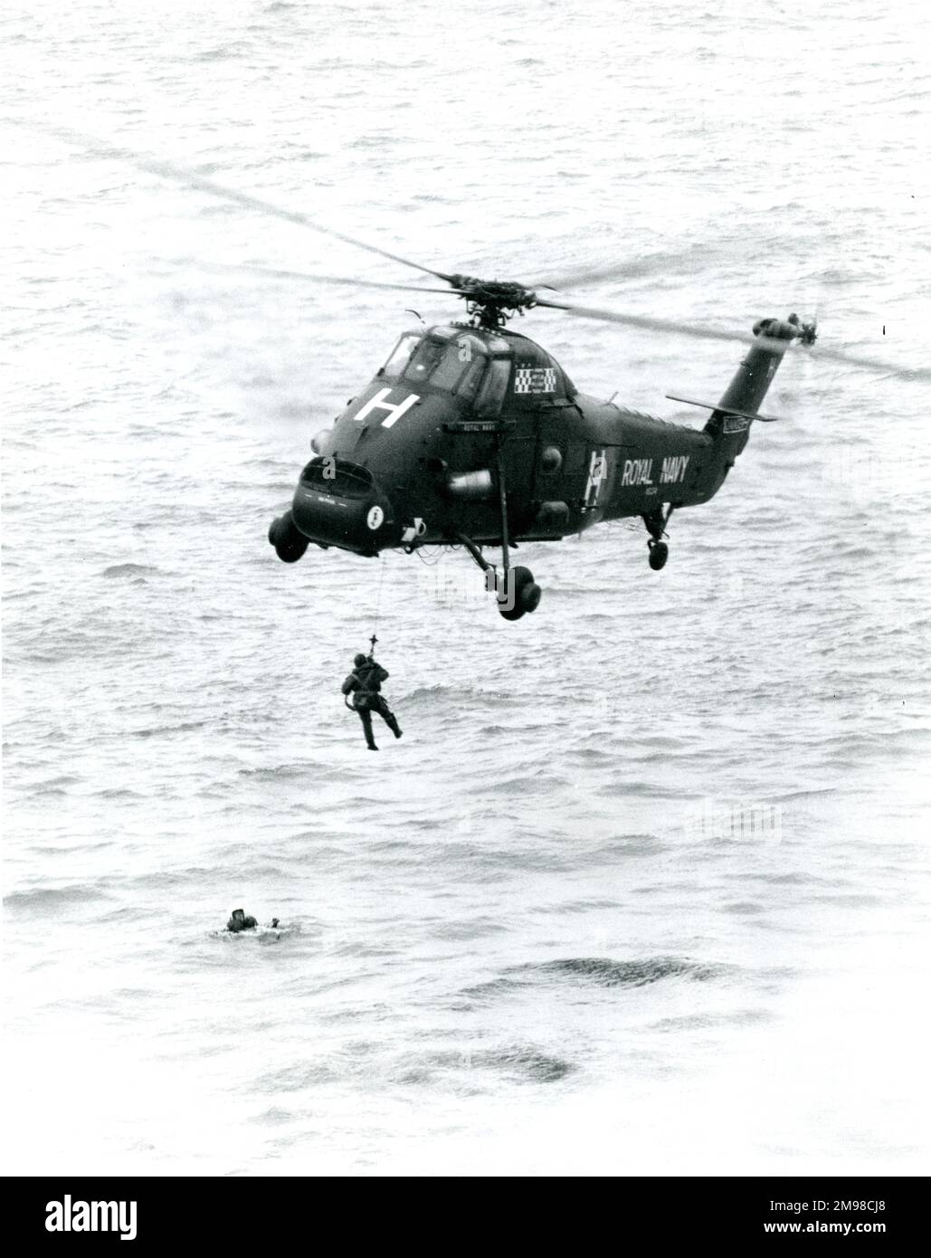 Westland Wessex performs a rescue at sea. Stock Photo
