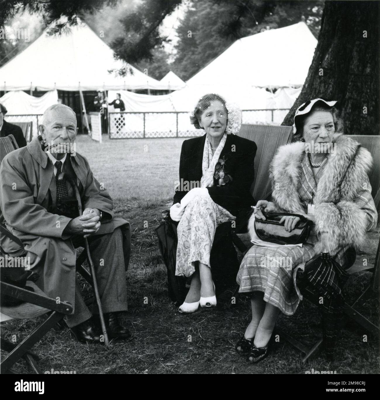 Mr and Mrs C.C. Walker with Lady Sorley in the centre at the 1953 Royal Aeronautical Society Garden Party at Hatfield on 14 June. Stock Photo