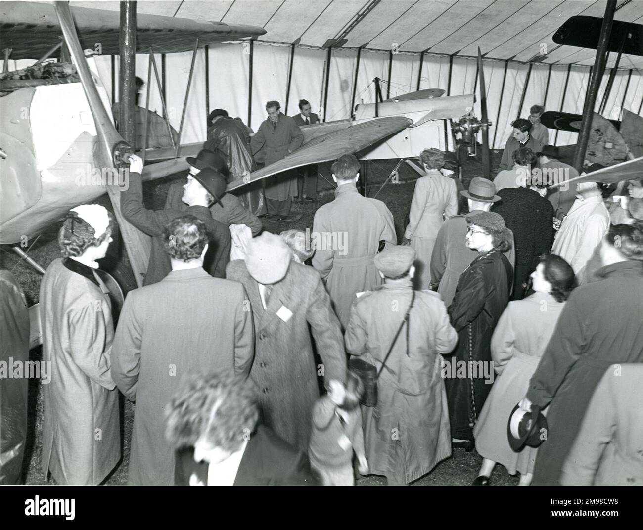 The nose of the Fokker DVII, left, and the Bl‚riot XXVII, centre, of the Nash Collection inside the marquee at the 1954 Royal Aeronautical Society Garden Party at London Airport on 13 June. Stock Photo