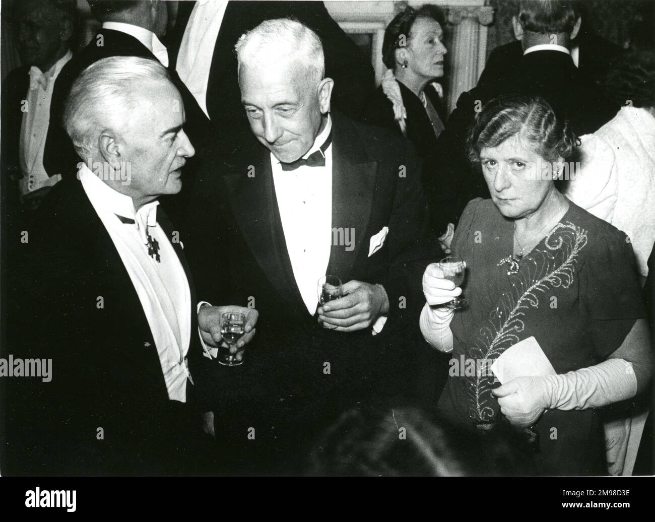 The Royal Aeronautical Society held a dinner at No.4 Hamilton Place in 1949 to celebrate the granting of its Royal Charter dated 22 December 1948. From left: A.G. Elliot, Dr H.J.Gough and Mrs Gough. Stock Photo