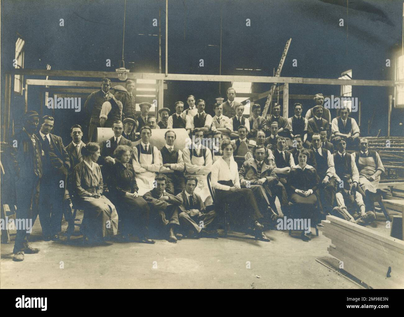 Personnel of the Whitehead Aircraft Co grouped around the company?s first aircraft, a BE2B. Whitehead is seated between the two women in the front row. circa 1915-16. Stock Photo