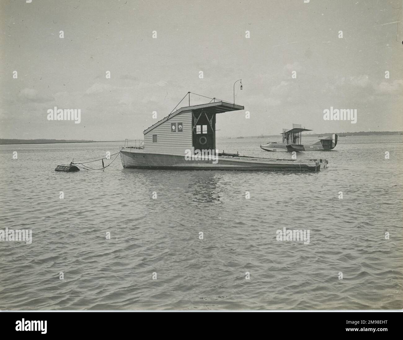 Towing lighter adapted to be a floating dock for flying boats. In the