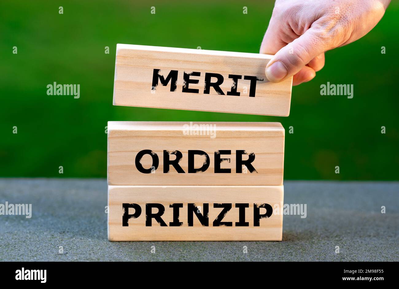 Blocks form the German expression 'merit order prinzip' (merit order principal). Symbol for the model determining the price for electricity in Germany Stock Photo
