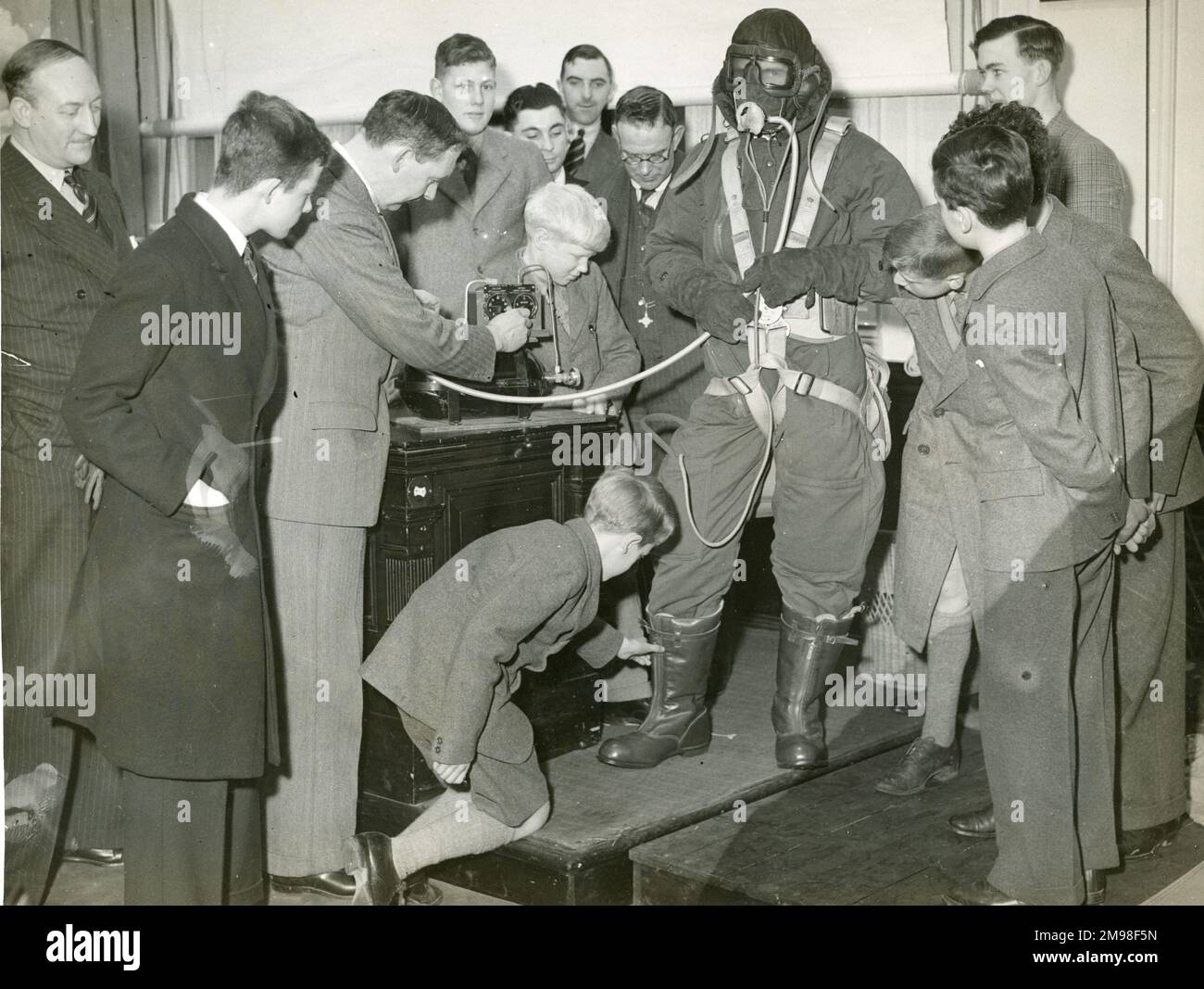 Professor G.T.R. Hill demonstrating a Sidcup flying suit at a Dr Mann Juvenile Lecture at the Royal Society of Arts, Adelphi, 13 January 1937. Stock Photo