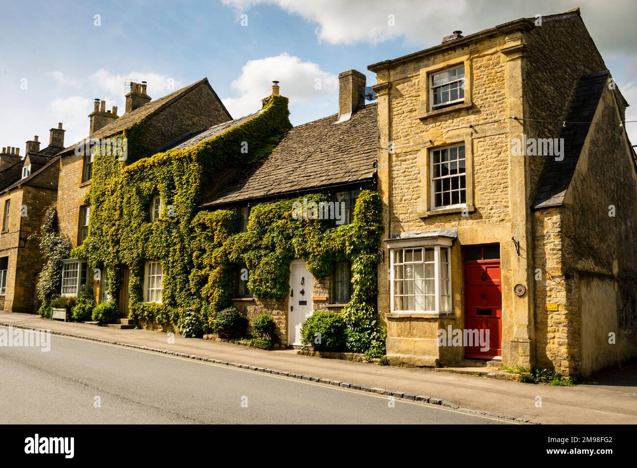 Three story terrace house Grade II Listed Building Rogers Cottage on Sheep Street in the