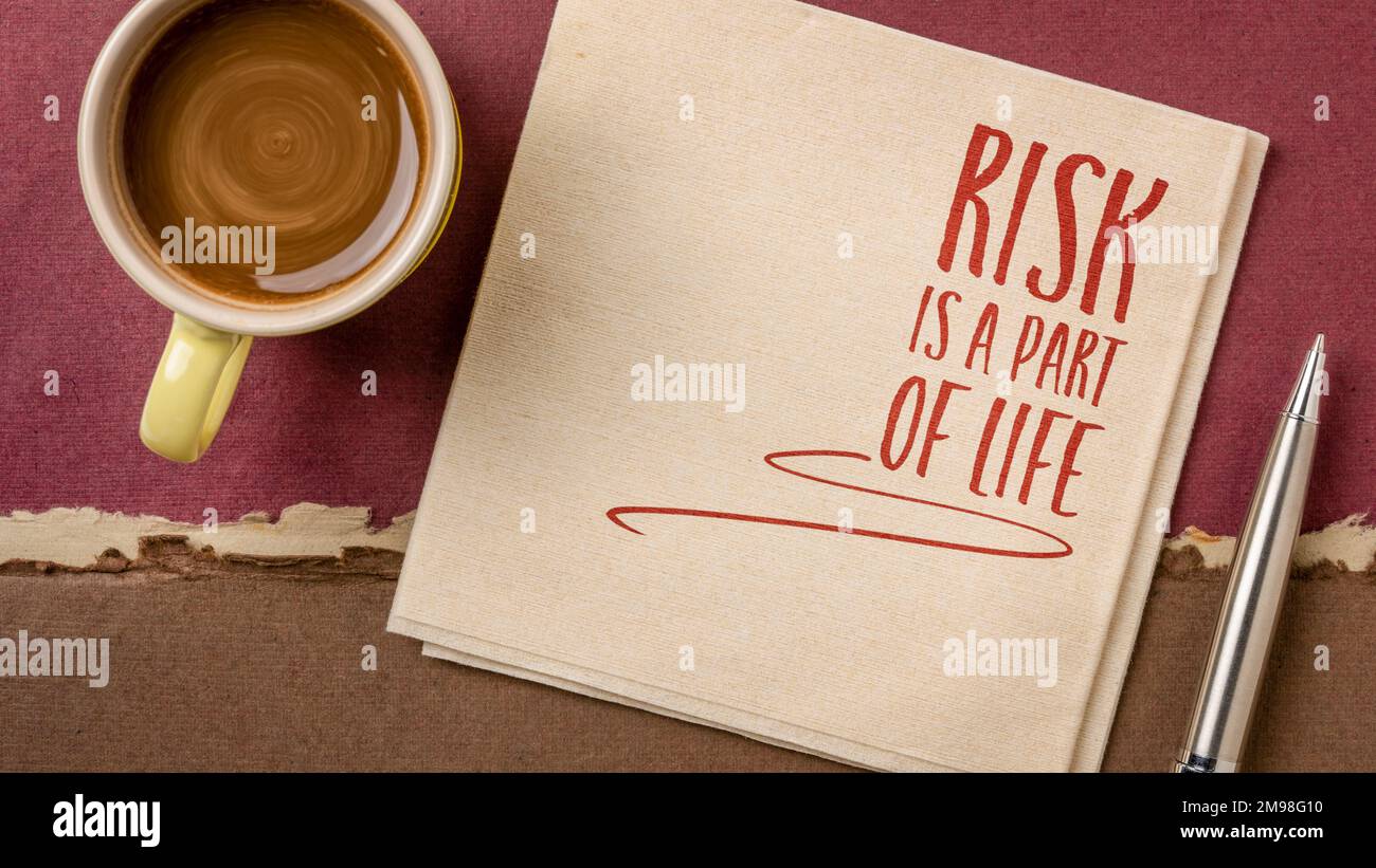 risk is a part of life - inspirational note or reminder on a napkin with a cup of coffee, business, career and personal development concept Stock Photo