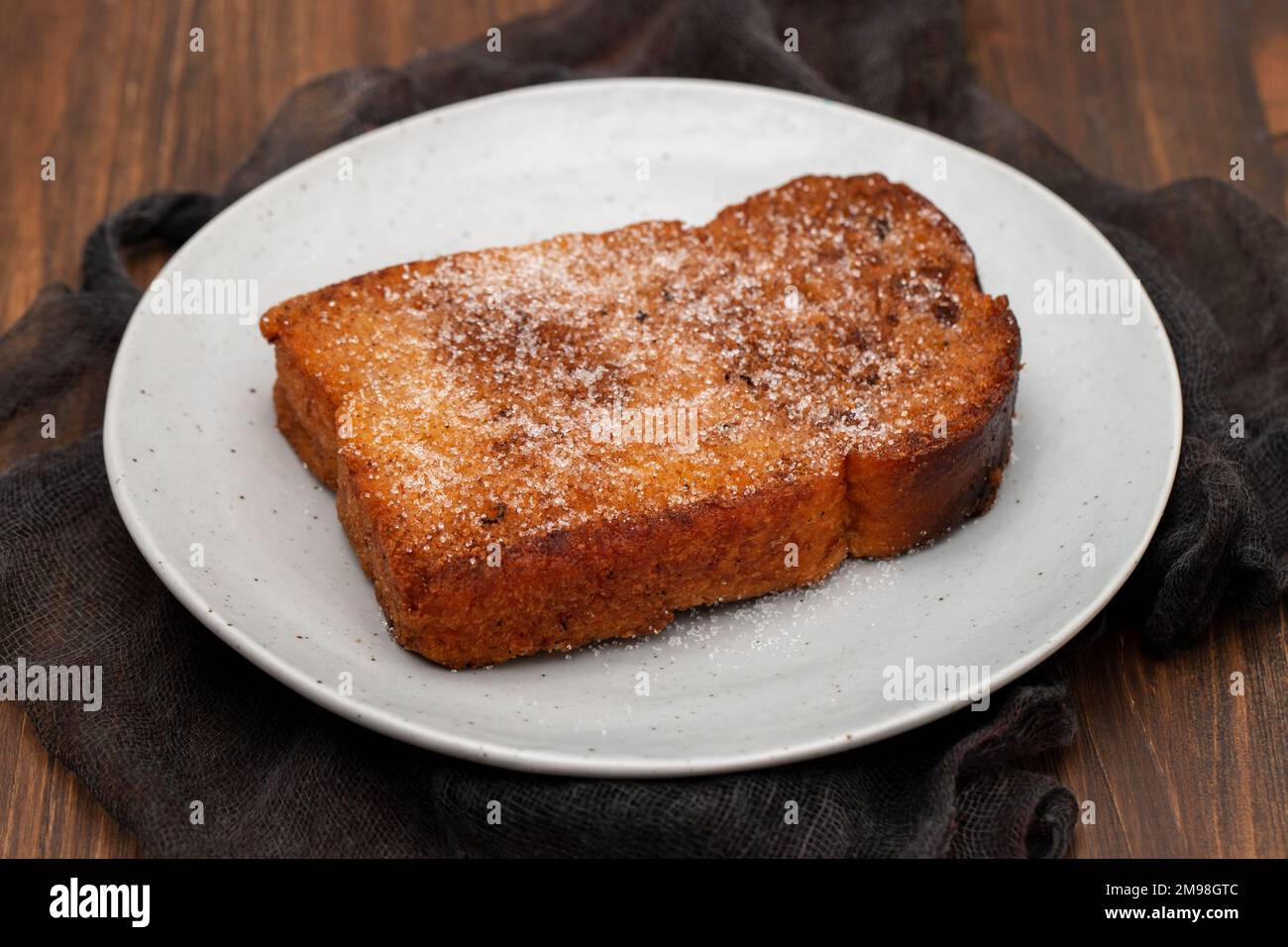 Baked or fried bread with sugar and cinnamon. Dessert called Rabanada. Stock Photo