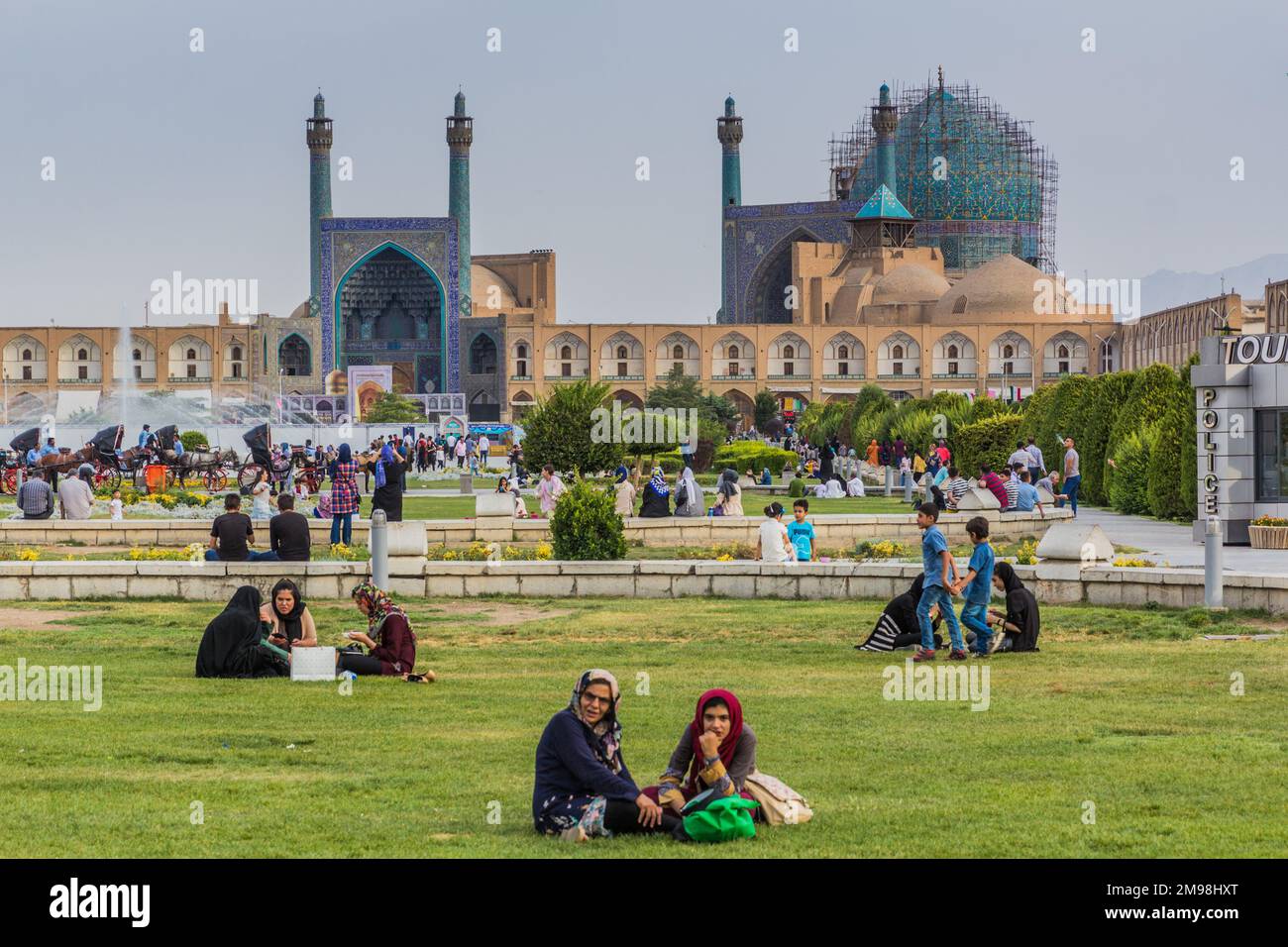 ISFAHAN, IRAN - JULY 10, 2019: People having picnic in front of the Shah Mosque at Naqsh-e Jahan Square in Isfahan, Iran Stock Photo