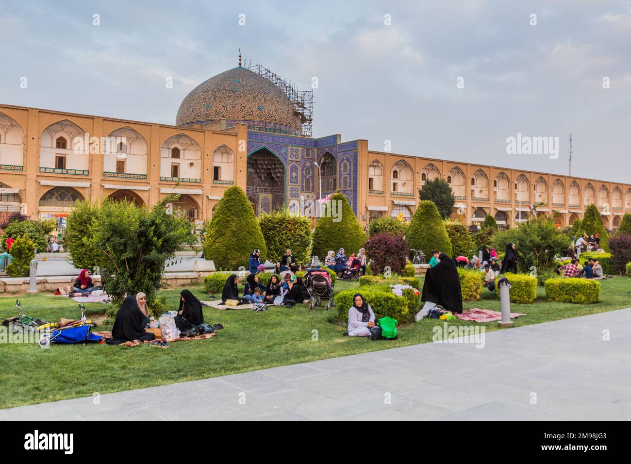 ISFAHAN, IRAN - JULY 10, 2019: People having picnic in front of the Sheikh Lotfollah Mosque at Naqsh-e Jahan Square in Isfahan, Iran Stock Photo