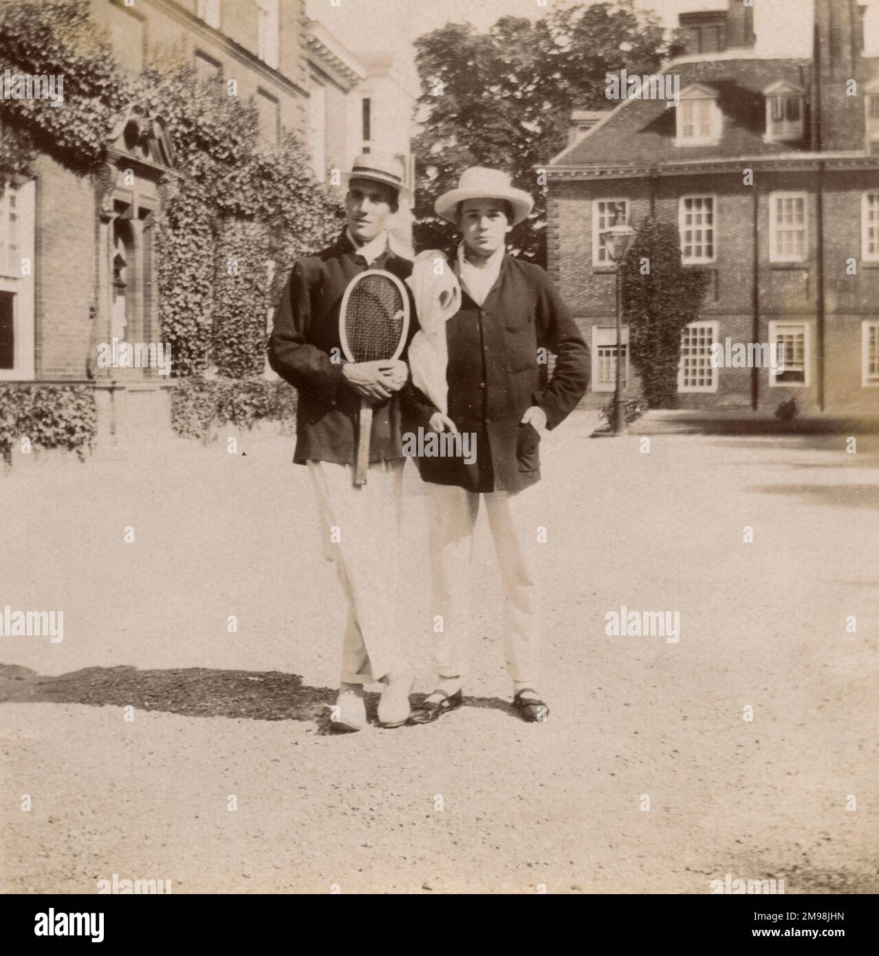 Two pupils at Marlborough College, Wiltshire, dressed for tennis. Stock Photo