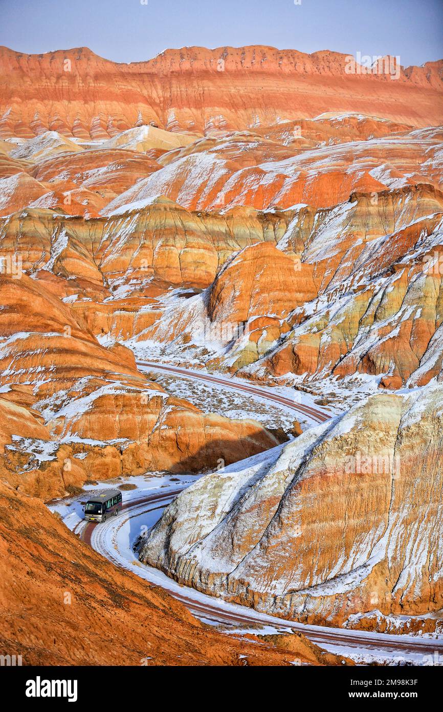 (230117) -- ZHANGYE, Jan. 17, 2023 (Xinhua) -- This photo taken on Jan. 15, 2023 shows the snow scenery of Danxia landform, characterized by reddish sandstone features, in Zhangye, northwest China's Gansu Province. (Photo by Wang Chao/Xinhua) Stock Photo