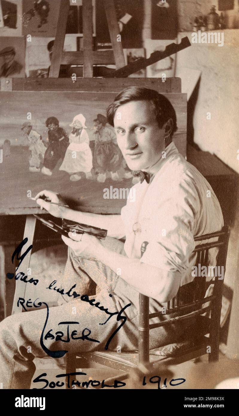 Reg Carter (1886-1949), freelance commercial artist, at work in his studio at Granville House, High Street, Southwold, Suffolk. He gave painting lessons to the young Harold Auerbach when the latter was in Southwold on holiday. Stock Photo