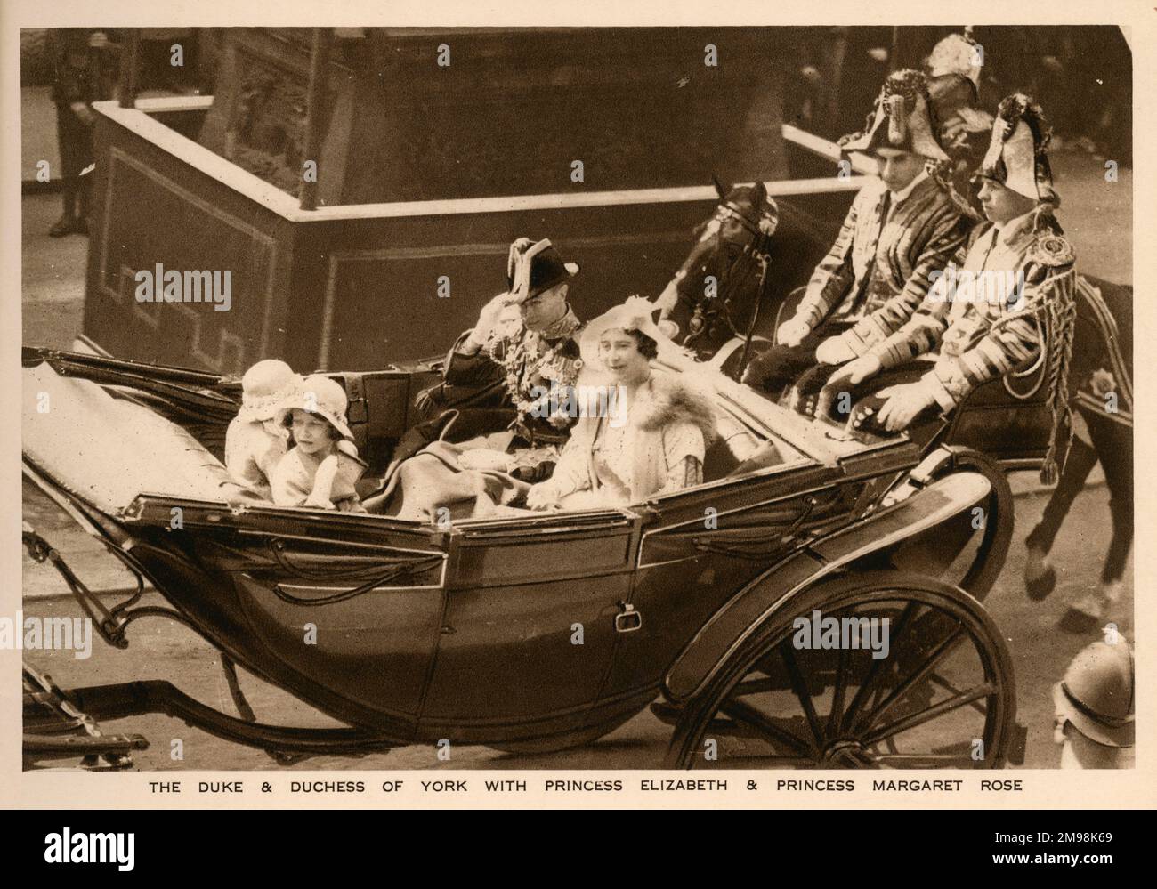 The Duke and Duchess of York with Princess Elizabeth and Princess Margaret Rose, in an open carriage on their way to St Paul's Cathedral for the Royal Silver Jubilee thanksgiving service, on 6 May 1935, to celebrate King George V's and Queen Mary's 25 years on the British throne. Stock Photo