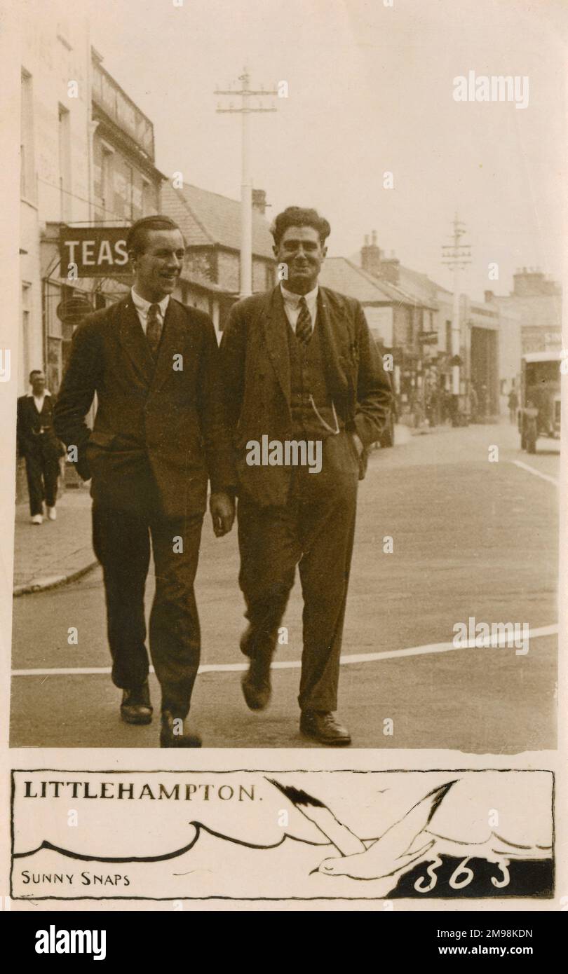 Pair of jolly young chaps off to the pub in Littlehampton, West Sussex Stock Photo