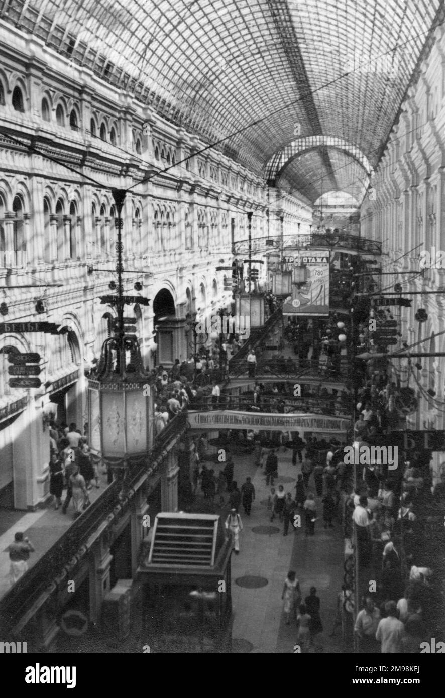 Interior view of a department store in the USSR -- probably GUM in Moscow, with its famous glass roof. Stock Photo