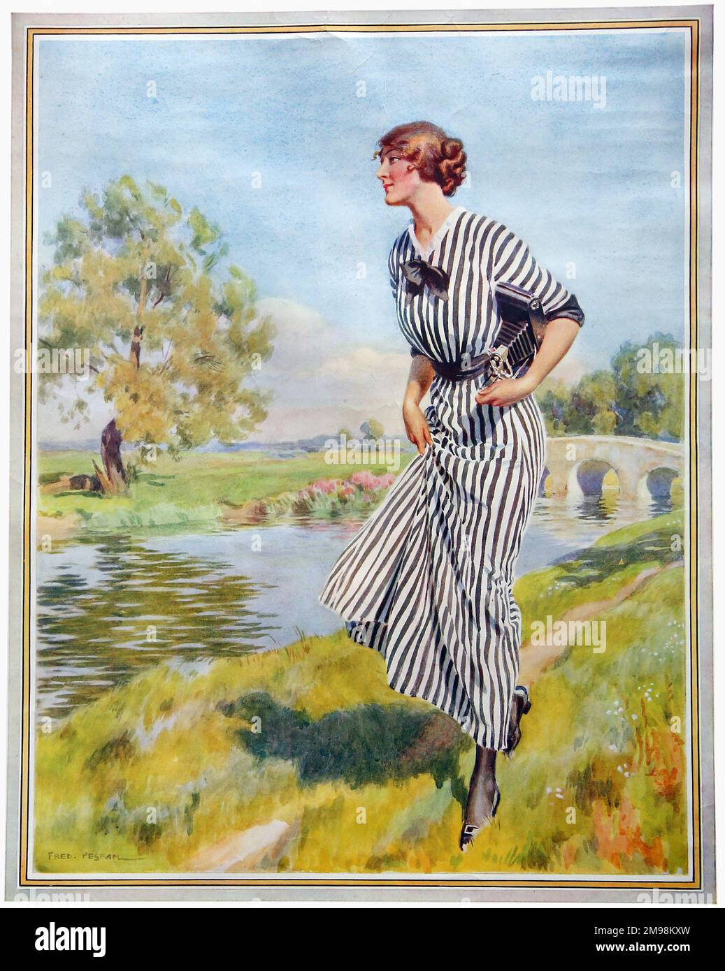 Poster Art, the Kodak Girl by a river in her distinctive black and white striped dress. Stock Photo
