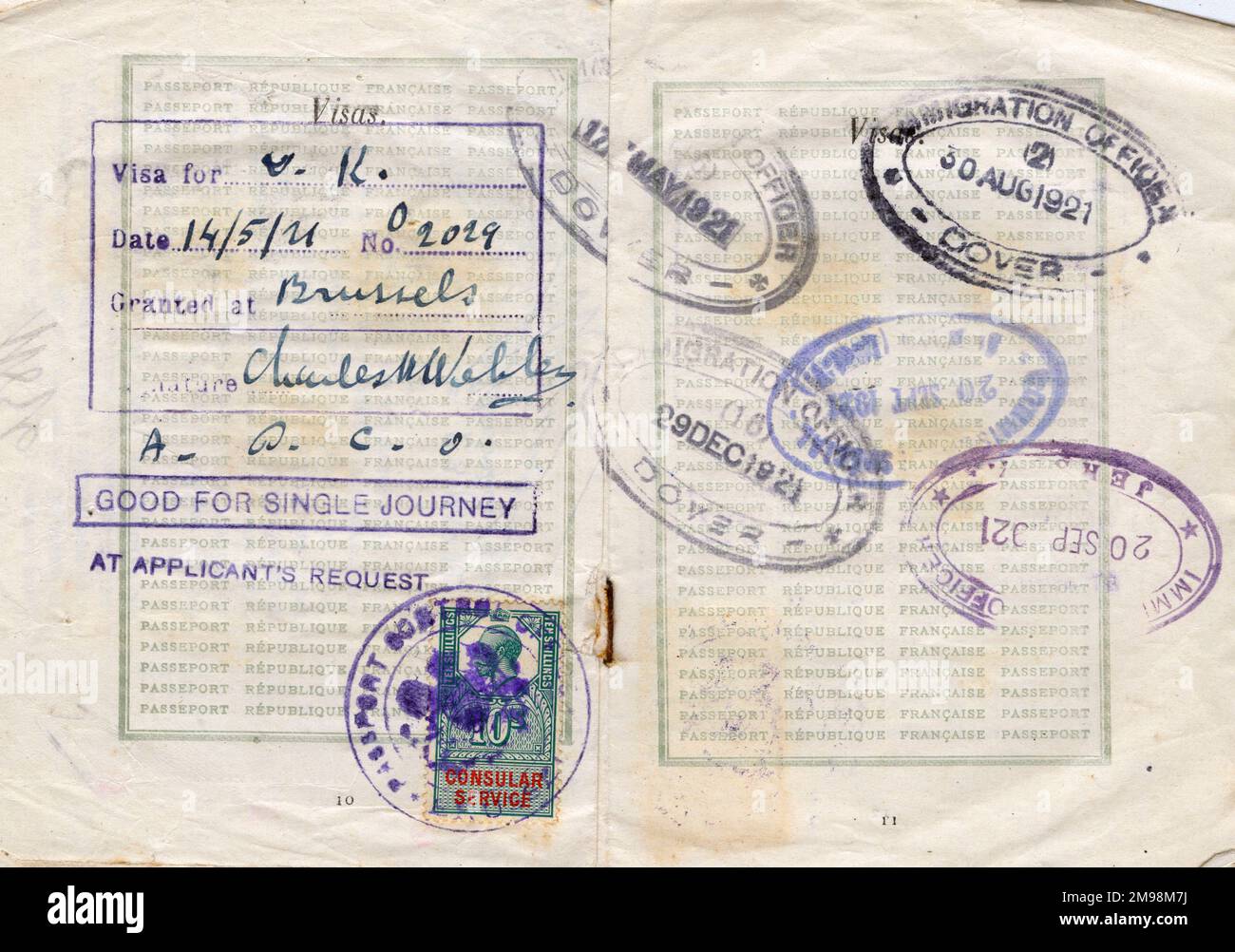 Visa pages with stamps in a French passport valid for one year from 15 March 1921, belonging to Mlle Henriette Stephanie Pannier, student. The stamps are from Dover and Jersey. Stock Photo