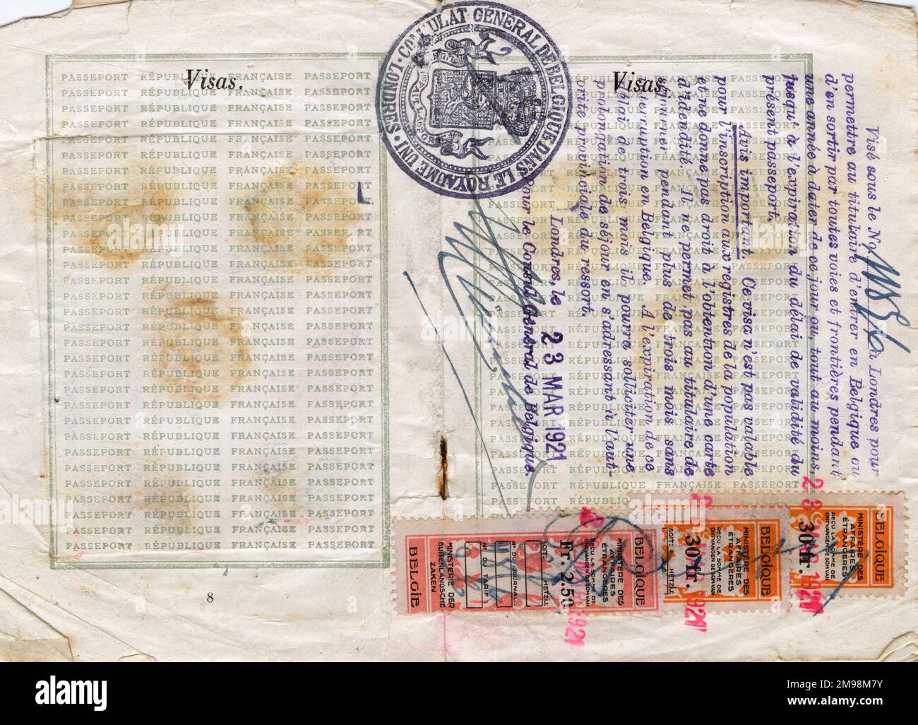 Visa pages with stamps in a French passport valid for one year from 15 March 1921, belonging to Mlle Henriette Stephanie Pannier, student. The stamps are from the Belgian Consulate in London, dated 23 March 1921. Stock Photo