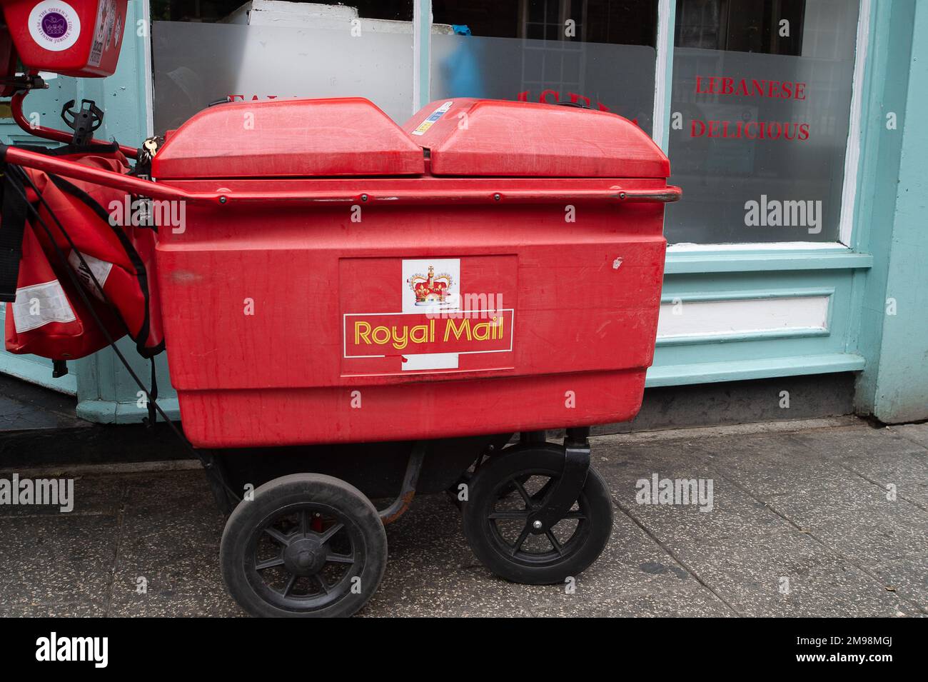 Windsor, Berkshire, UK. 21st July, 2022. A postal worker doing mail