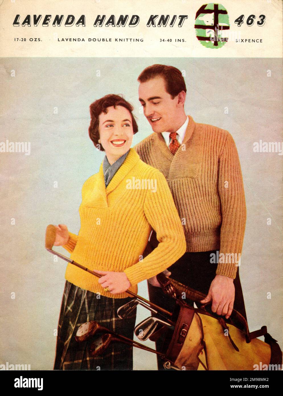 Golfing couple in ribbed knitted jumpers. Stock Photo