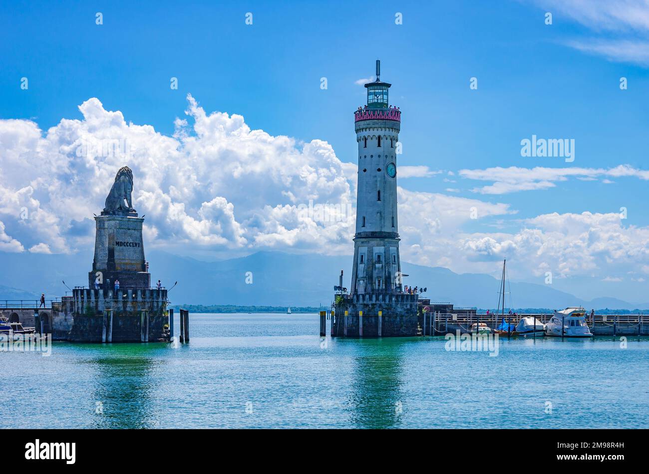 Harbour entrance of Lindau in Lake Constance, Bavaria, Germany, flanked by the Bavarian Lion and Lighthouse, the landmarks of Lindau. Stock Photo