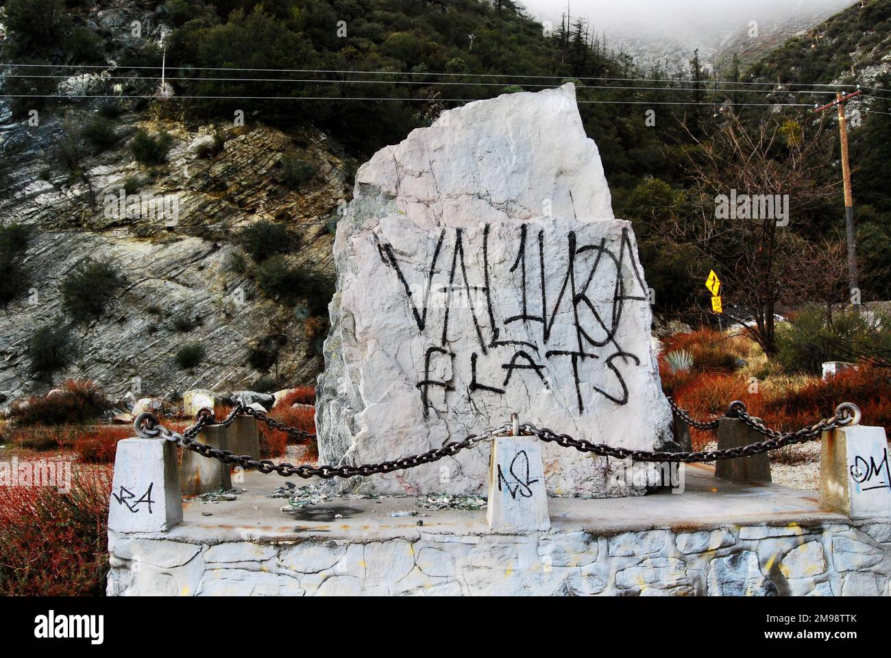 Graffiti on a special rock. Man versus civilization Stock Photo