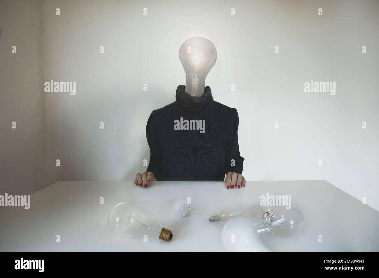 surreal person with a light bulb placed on his head who chose the best idea, concept of choice, creativity, business, ideas, freedom Stock Photo