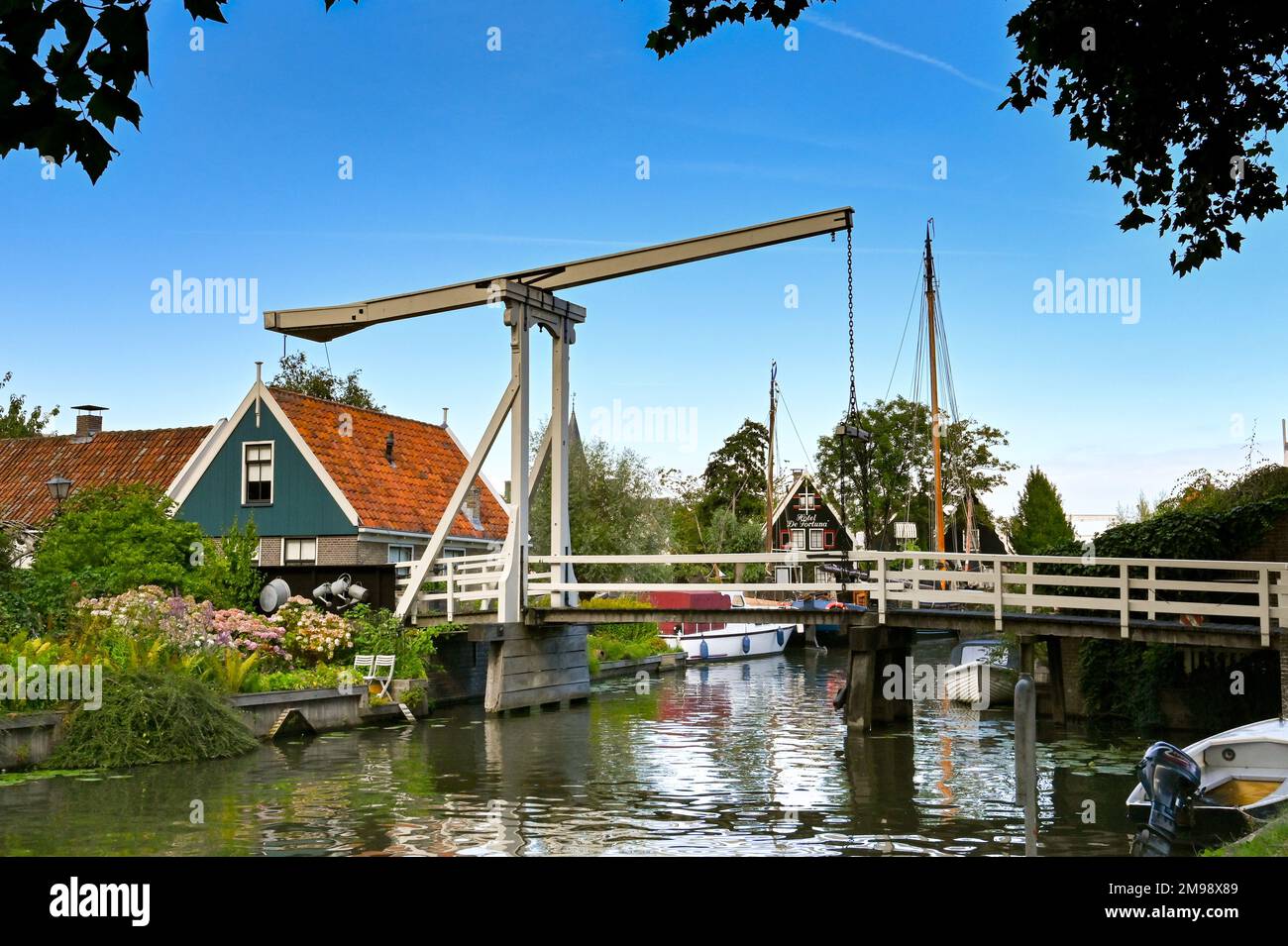 Zaandam, Netherlands - August 2022: Old wooden lifting bridge over one of the canals in the centre of the Dutch town of Edam, famous for its cheese Stock Photo