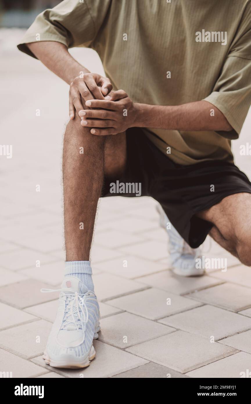 Adult athlete suffering from acute knee pain Stock Photo Alamy