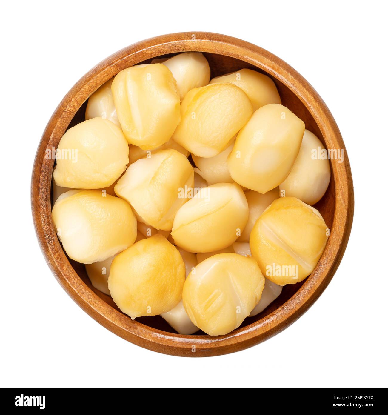 Mini spizzico of smoked scamorza, in a wooden bowl. Tiny morsels of Italian pasta filata, stretched curd cheese, with intense aroma and tawny color. Stock Photo