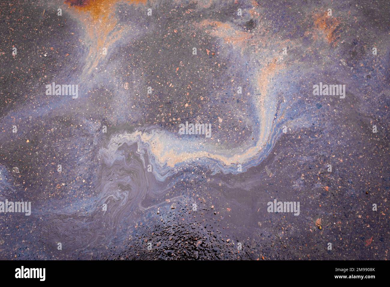 Petrol stain on asphalt road, polluted puddle water Stock Photo Alamy