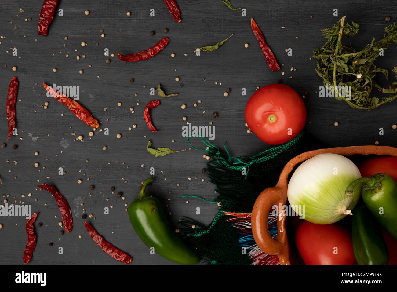 Background of ingredients to make a sauce, such as tomato, onion and chili peppers Stock Photo