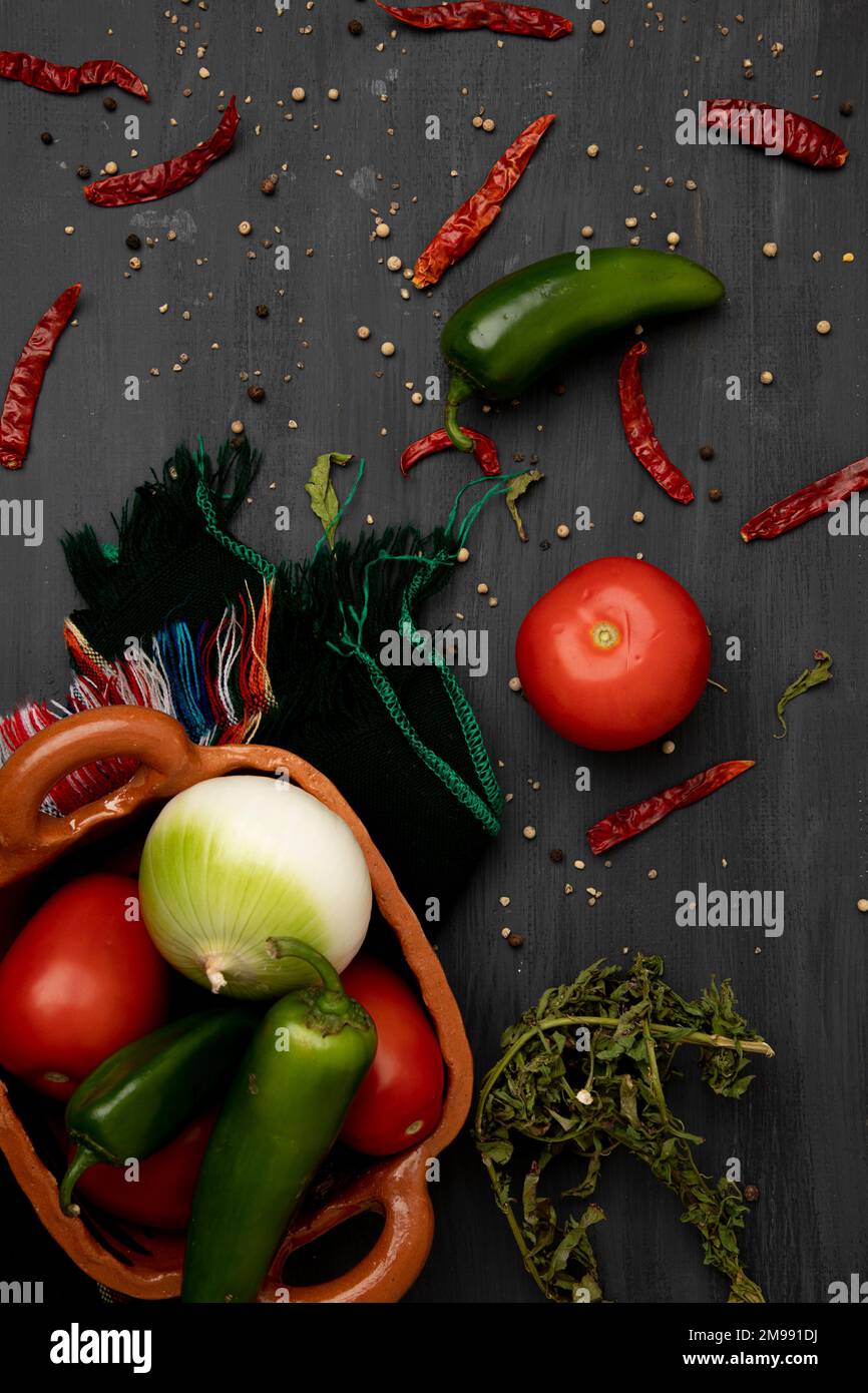 Background of ingredients to make a sauce, such as tomato, onion and chili peppers Stock Photo