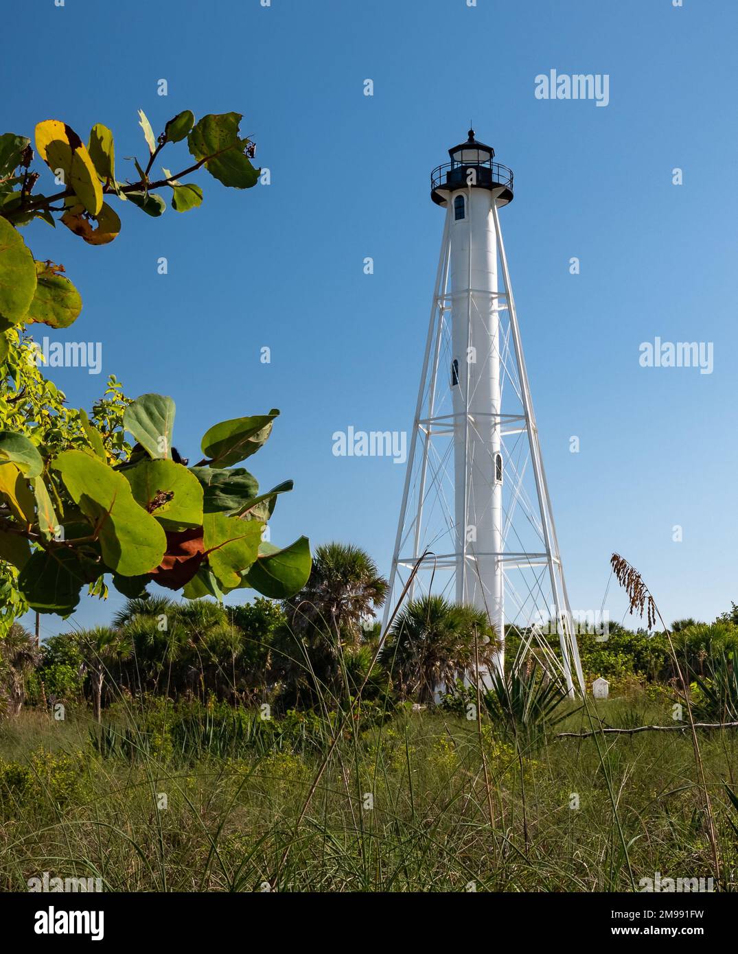 Historic white Lighthouse located on the beach in Boca Grande, Florida. Stock Photo