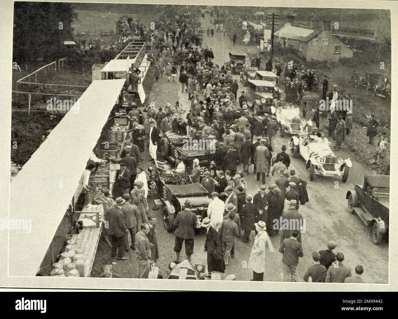 Early Motor Car Racing - Drivers overtake Carraciola in No. 70 Mercedes (right). Stock Photo