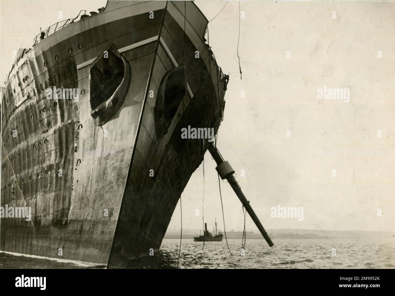 L'Atlantique, French luxury liner, towed home in a battered state into Cherbourg harbour, Northern France, January 1933. Stock Photo
