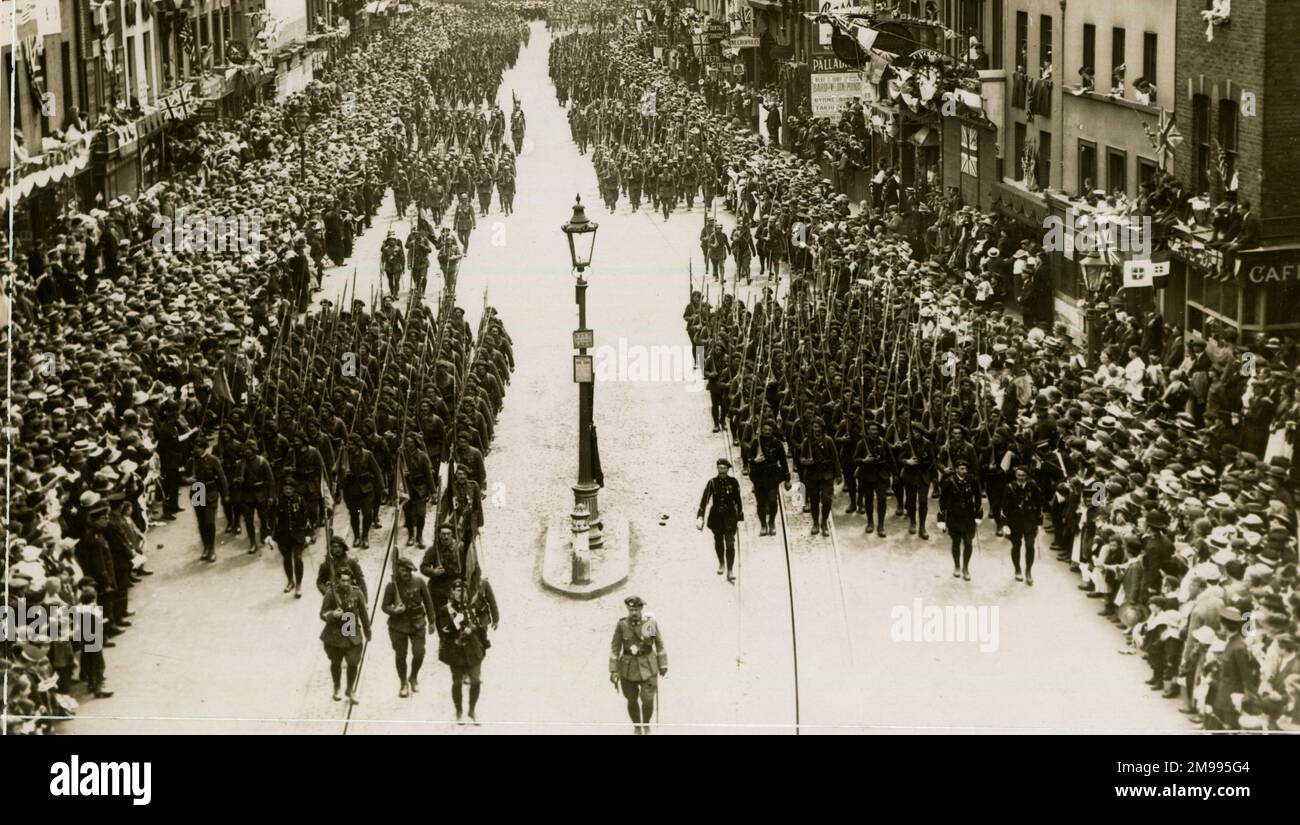 WW1 Peace celebrations in London - French Infrantry pass along Westminster Bridge Road. Stock Photo