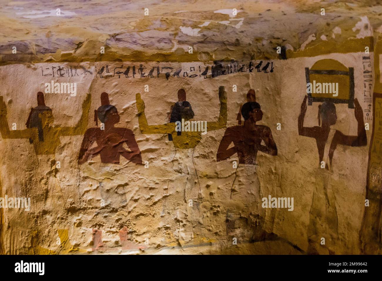 BAWITI, EGYPT - FEBRUARY 5, 2019: Wall painitngs in the Zed Amun Ef Ankh Tomb in Bahariya oasis, Egypt Stock Photo