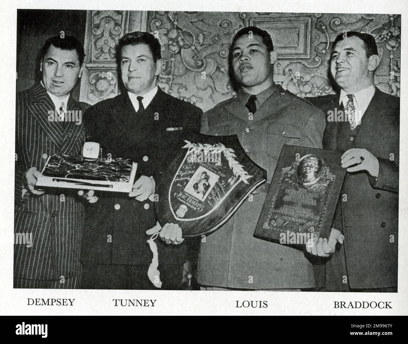 Four world boxing champions (left to right): Jack Dempsey, Gene, Tunney, Joe Louis, James J Braddock. Stock Photo